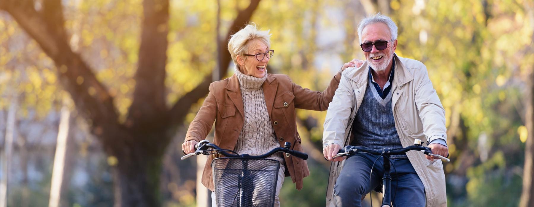 a man and woman riding bikes