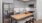 Kitchen with island, stainless steel appliances and tile backsplash