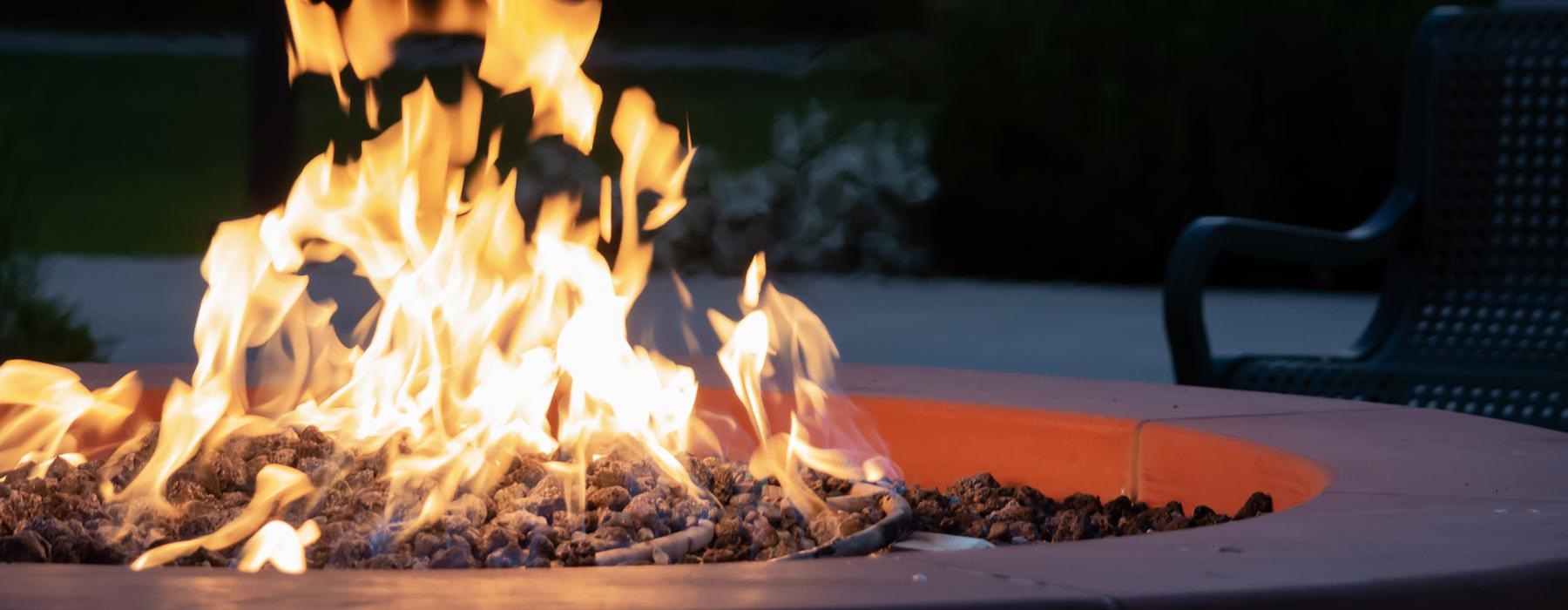 chair next to an outdoor fire pit