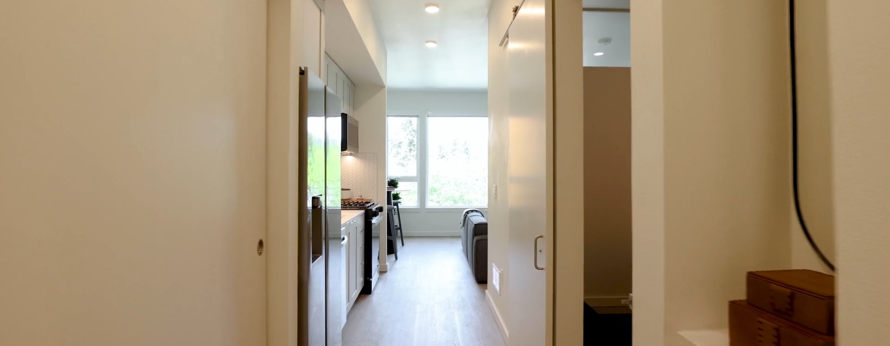 hallway that leads to a living area